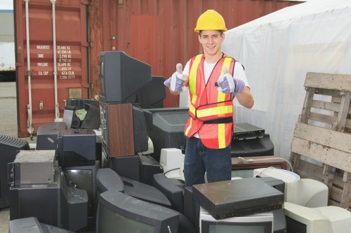 Staff unloading bins at a commercial site in Brixton